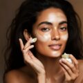 Woman applying herbal salve