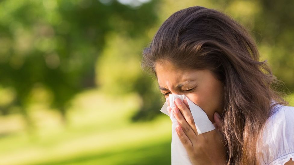 Woman Sneezing in the Park